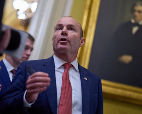 a man speaks in a corridor